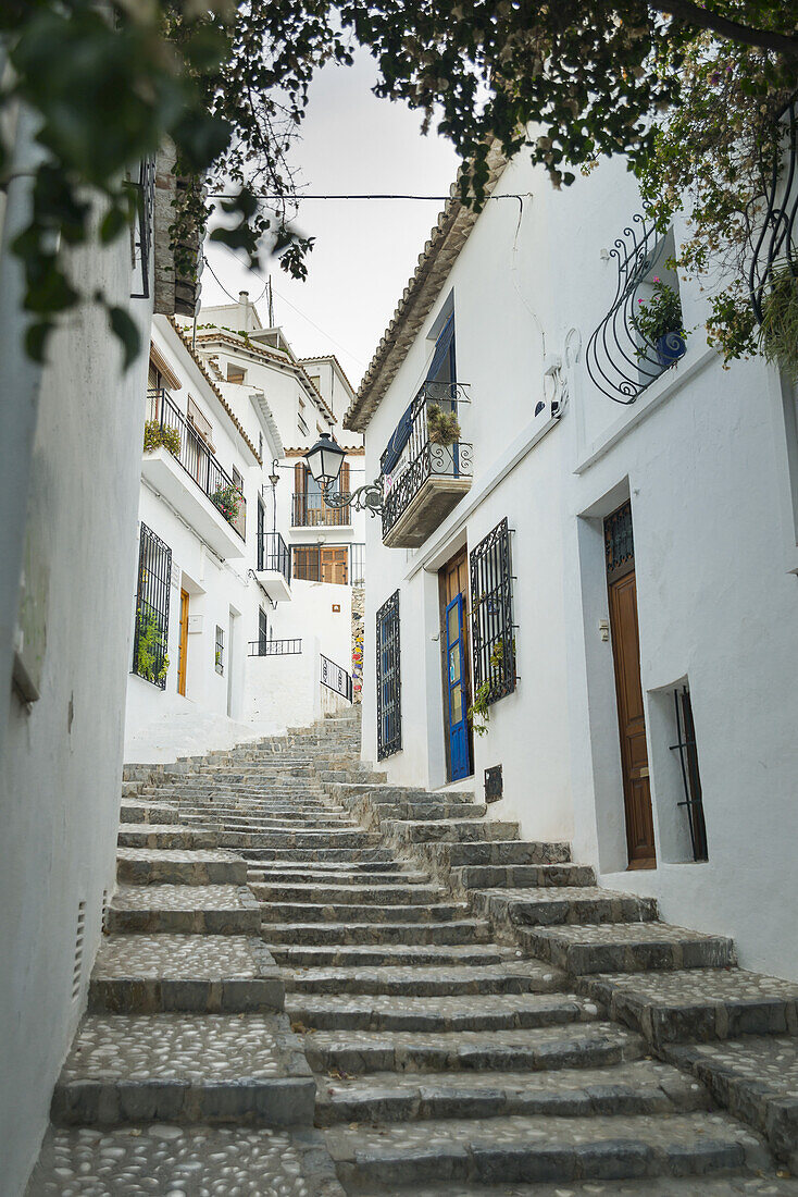 Steps Up A Sloped Street In The Beautiful Town Of Altea In Costa Blanca, Where The Houses Are Painted With The Typical Mediterranean Colours, White Walls And Blue Doors And Windows; Altea, Alicante, Spain