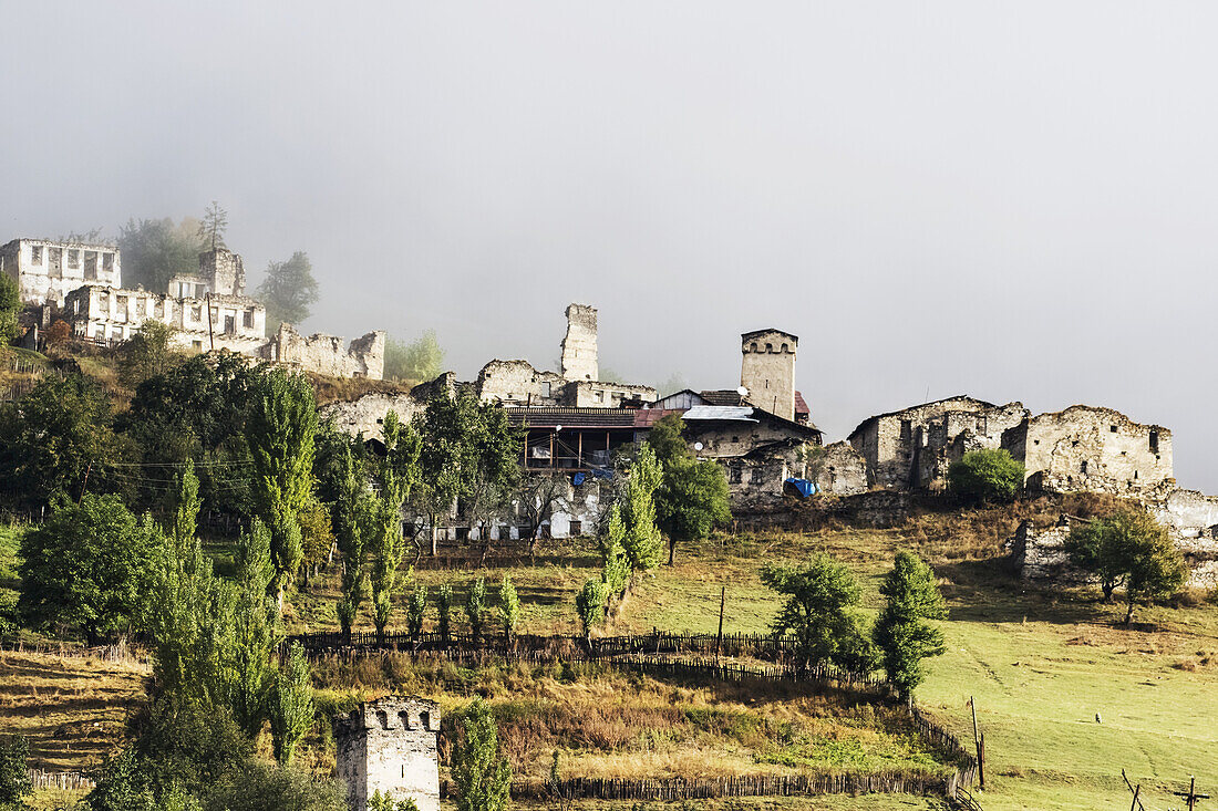 Village With Svan Towers Between Mestia And Ushguli In Low Clouds, Upper Svaneti; Samegrelo-Zemo Svaneti, Georgia