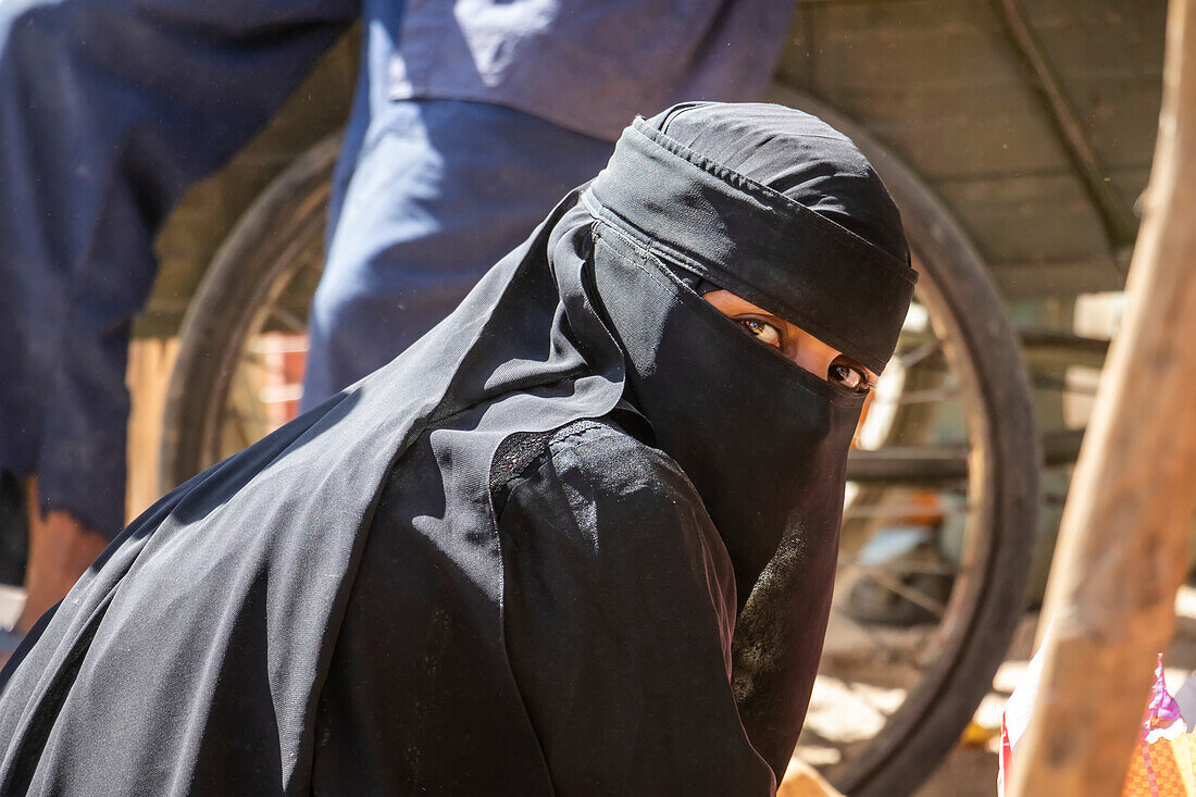 Eritrean woman in a Niqab at the open air market; Keren, Anseba Region, Eritrea