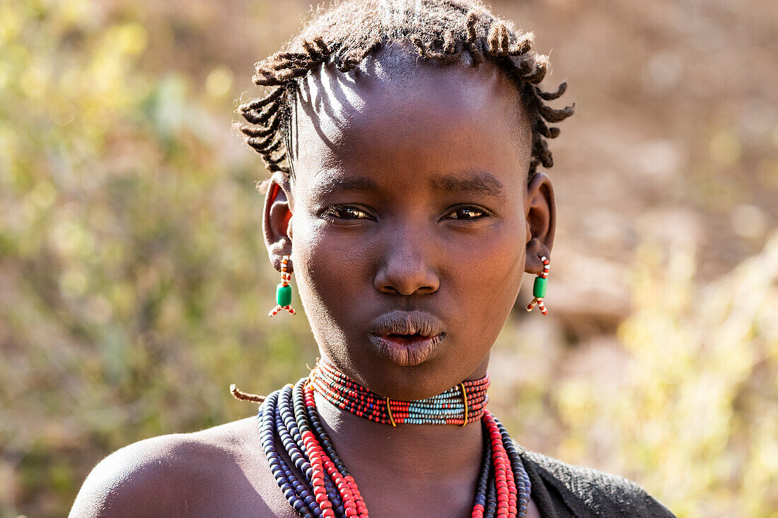 Hamer woman at a bull jumping ceremony, which initiates a boy into manhood, in the village of Asile; Omo Valley, Ethiopia