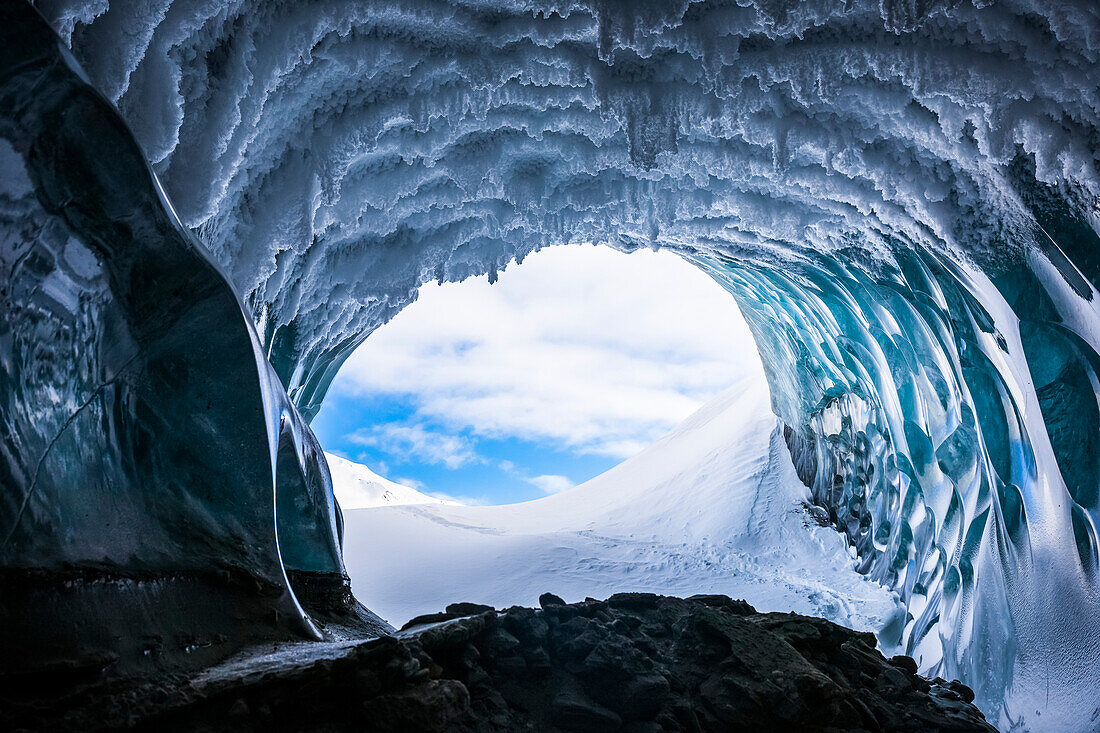 Hoarfrost hangs from the ceiling of a Canwell Glacier ice cave in winter; Alaska, USA