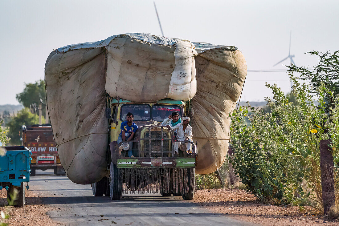 Truck carrying a huge load of wheat in … – License image – 13775859 ❘ Image  Professionals