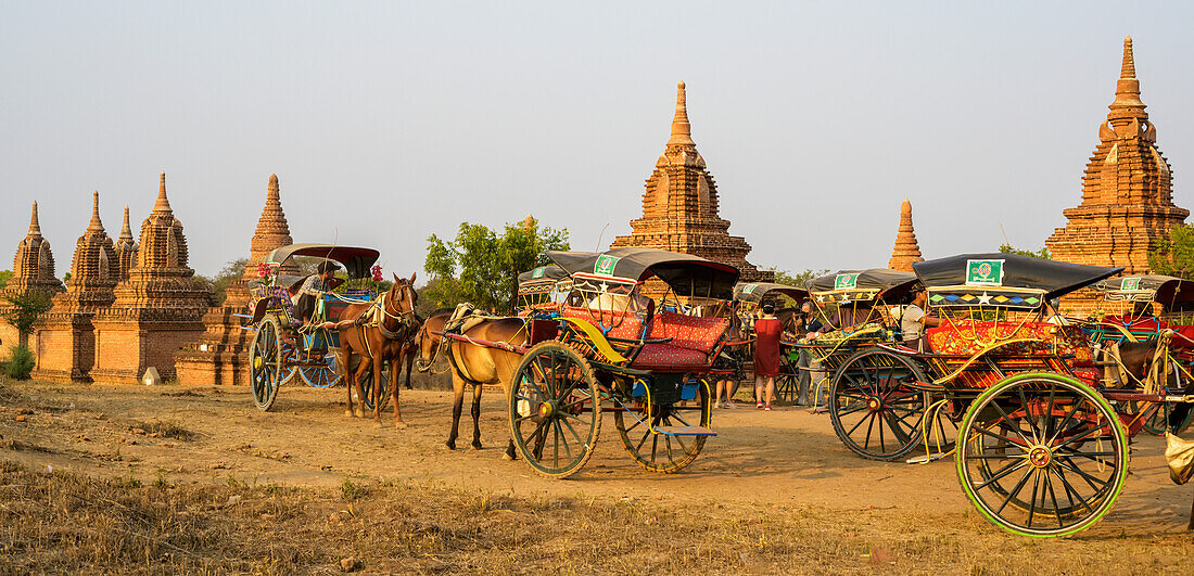 A Buddhist temple with horses and carriages; Bagan, Mandalay Region, Myanmar