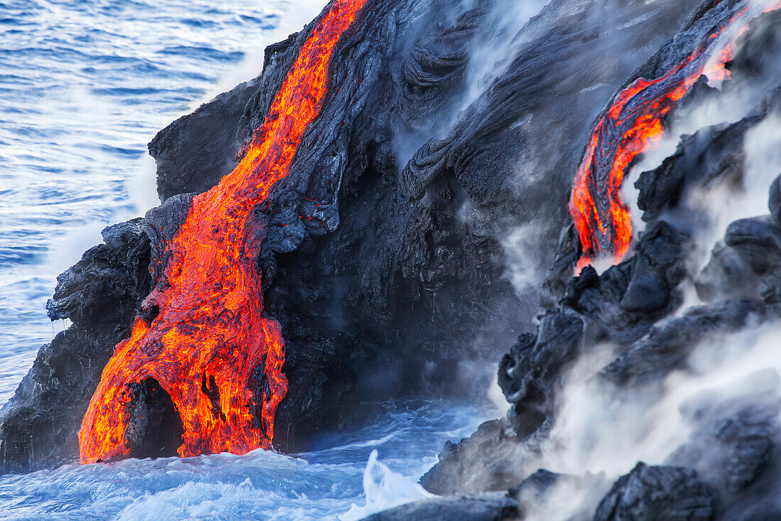 The Pahoehoe lava flowing from Kilauea has reached the Pacific ocean near Kalapana, Big Island; Island of Hawaii, Hawaii, United States of America