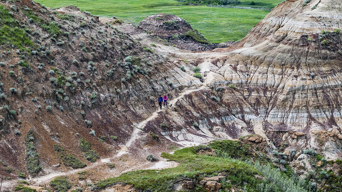 Tourists on a trail in Horse Thief Canyon, Starland County; Alberta, Canada