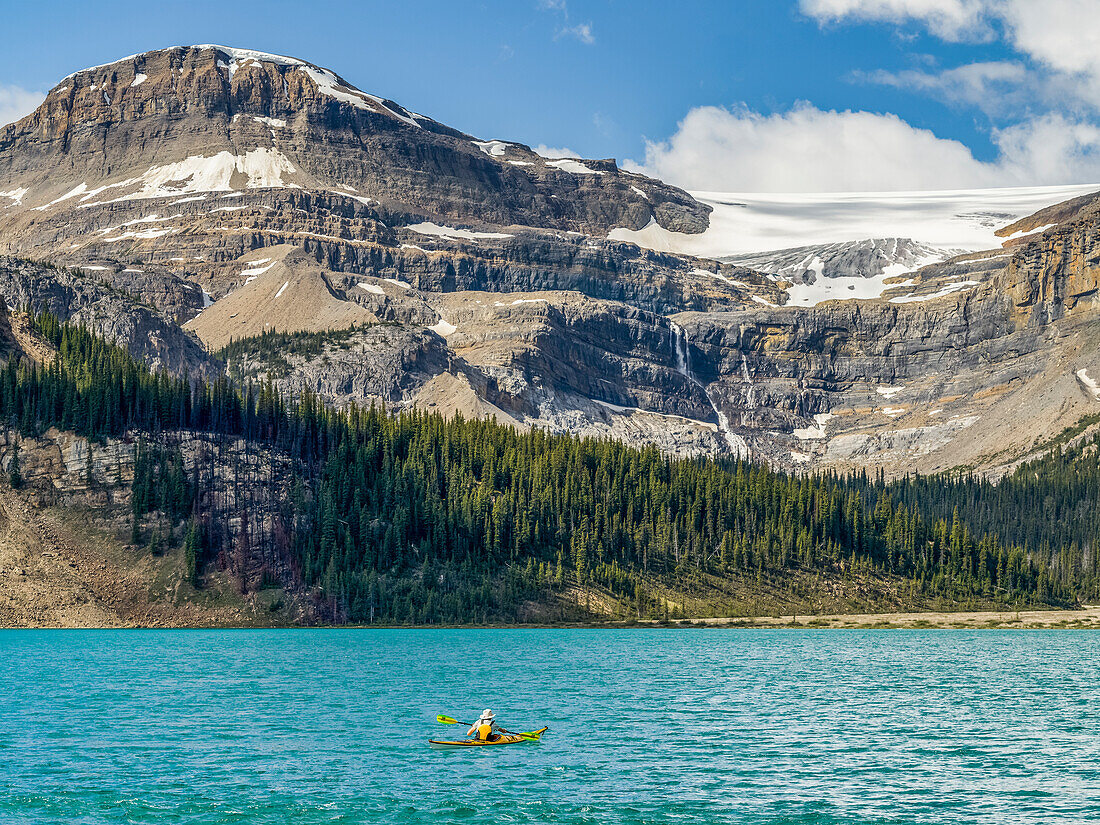 Kayaking in Bow Lake, Banff National Park; Improvement District No. 9, Alberta, Canada