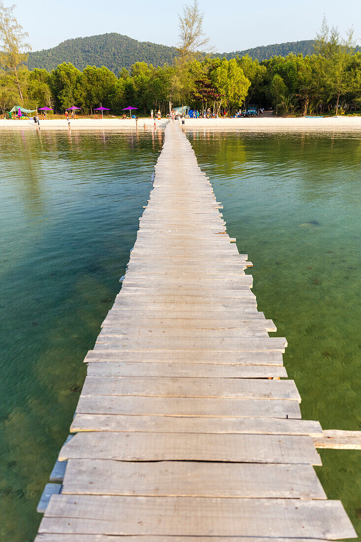 Long wooden dock leading out to the water from Starfish Beach; Phu Quoc, Kien Giang Province, Vietnam