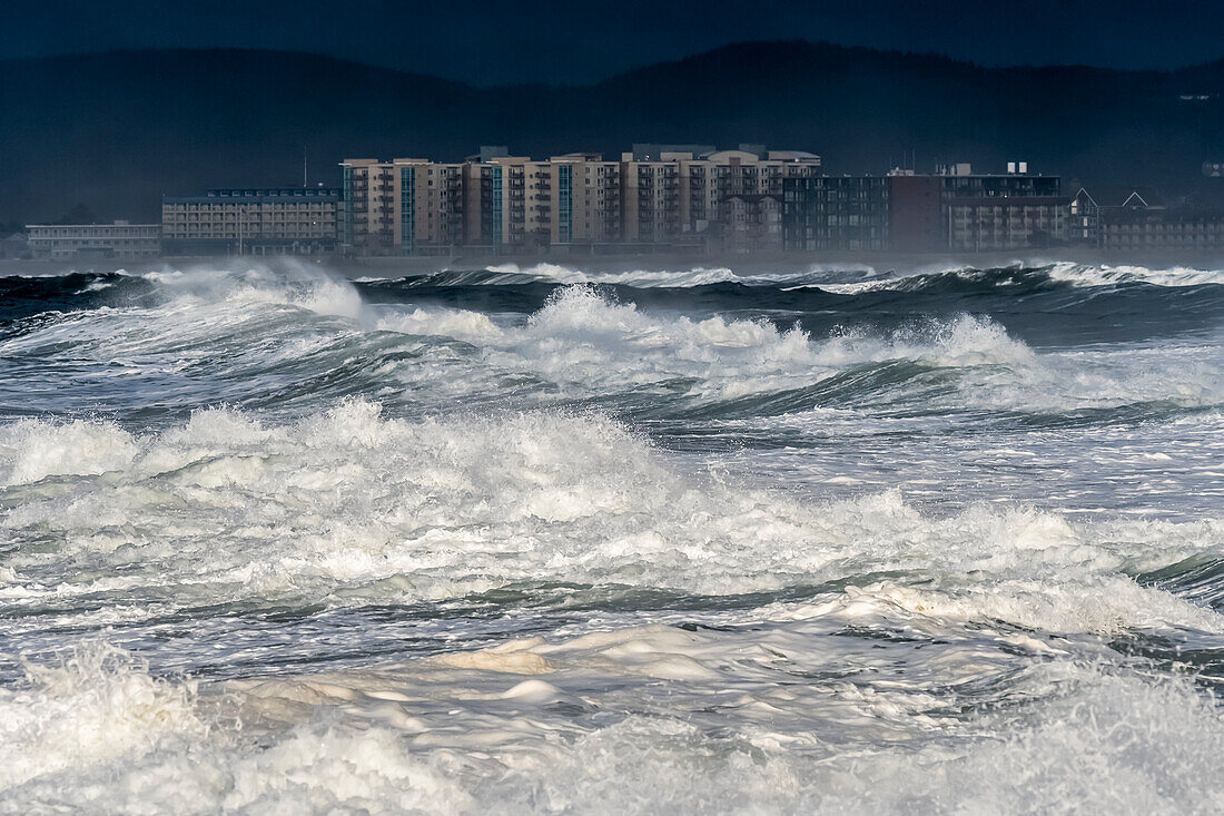 Storm light brings drama to an Oregon seascape; Seaside, Oregon, United States of America