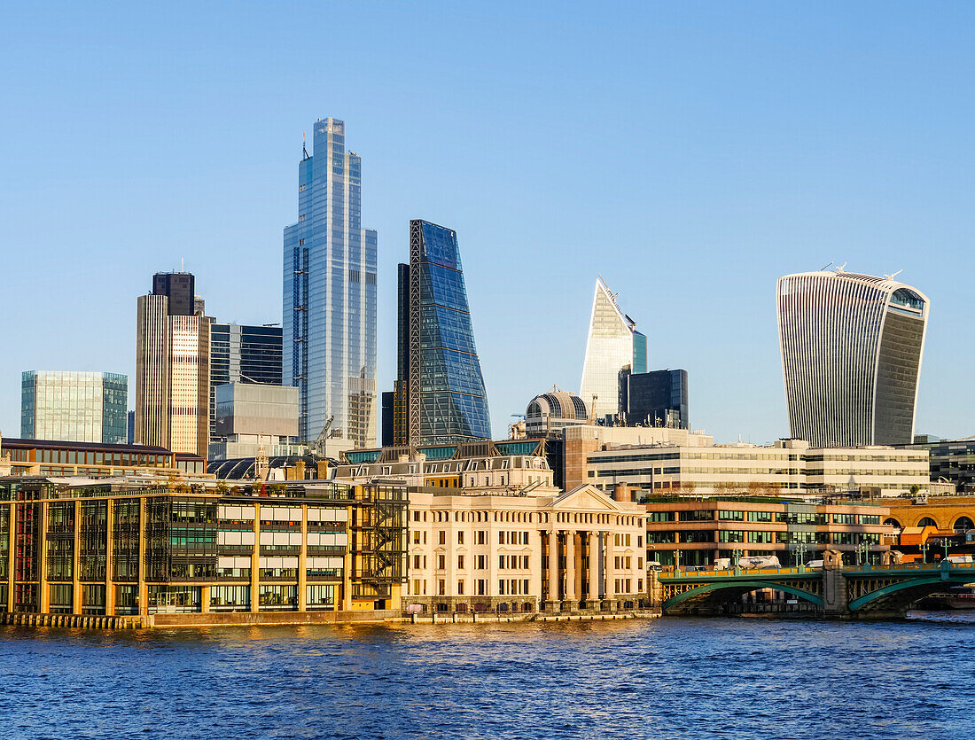 Cityscape and skyline of London with 20 Fenchurch, 22 Bishopsgate, and various other skyscrapers, and the River Thames in the foreground; London, England