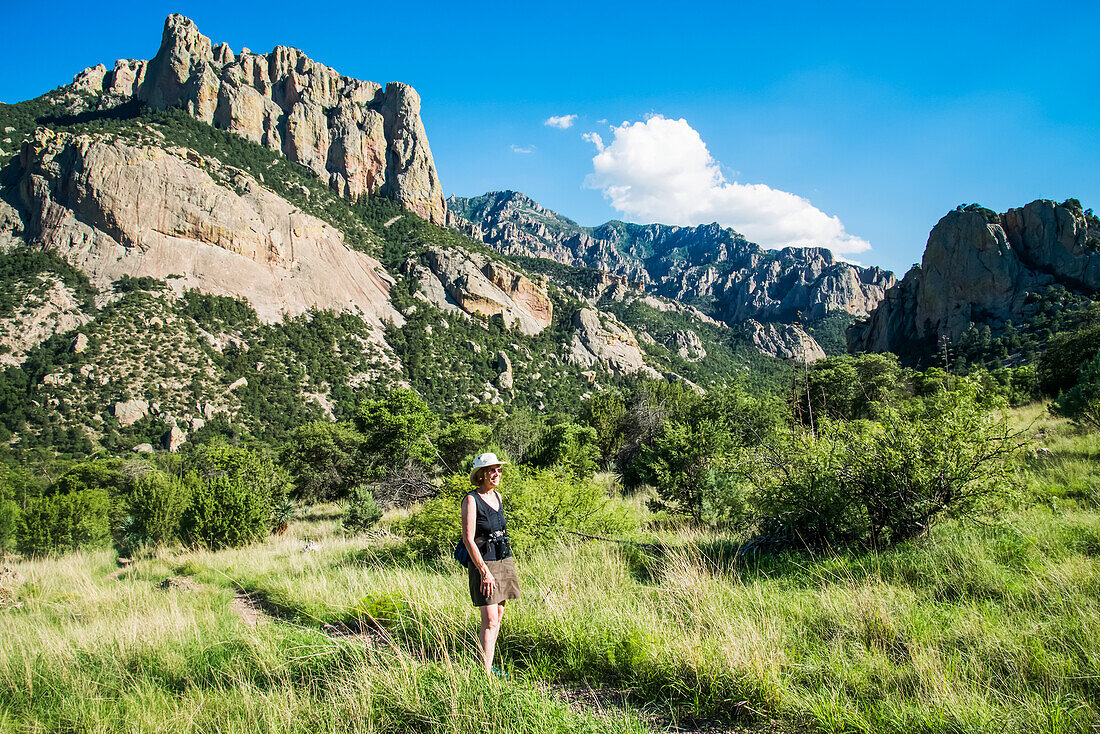 Woman hiking in Cave Creek Canyon in the Chiricahua Mountains near Portal; Arizona, United States of America