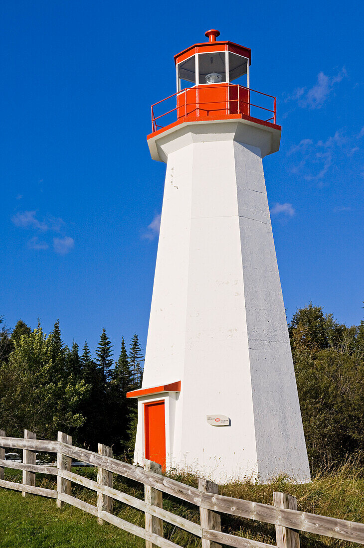 Lighthouse by Fence, Grande Bergeronne, Cote Nord, Quebec, Canada