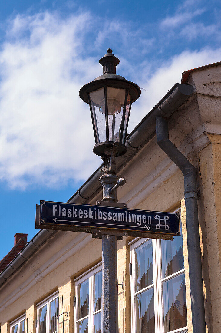 Close-up of Lamppost and Street Sign, Flaskeskibssamlingen (museum) Aeroskobing, Aero Island, Jutland Peninsula, Region Syddanmark, Denmark, Europe