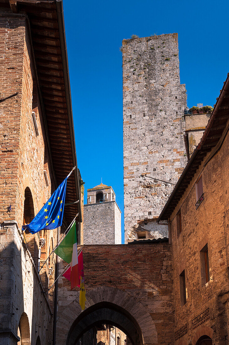 Buildings and Flags, San Gimignano, Province of Siena, Tuscany, Italy