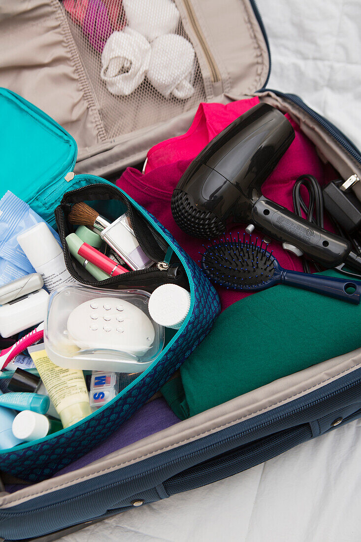 Women's Toiletry Travel Bag in Packed Suitcase