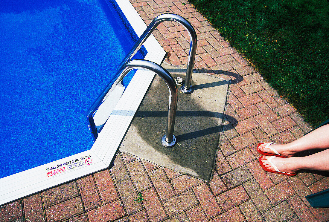 Woman's Legs by Swimming Pool