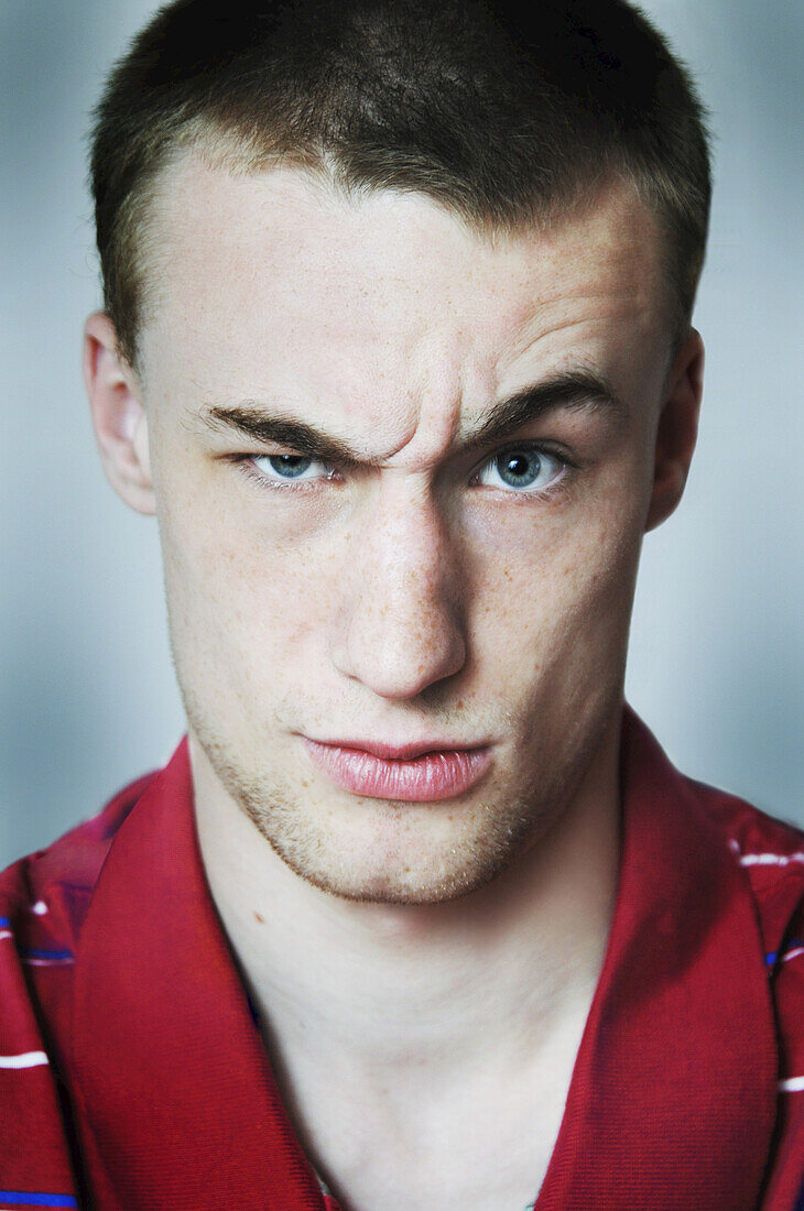 Portrait of Young Man with Raised Eyebrow