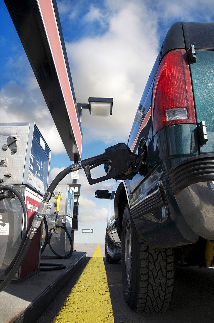Close-up of truck being filled up at gas station, Trans Canada Highway, near Thunder Bay, Ontario, Canada