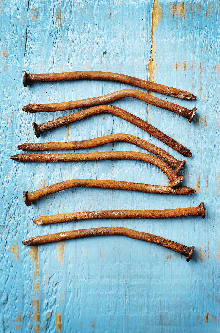 Close-up of Rusty Nails on Painted Wood