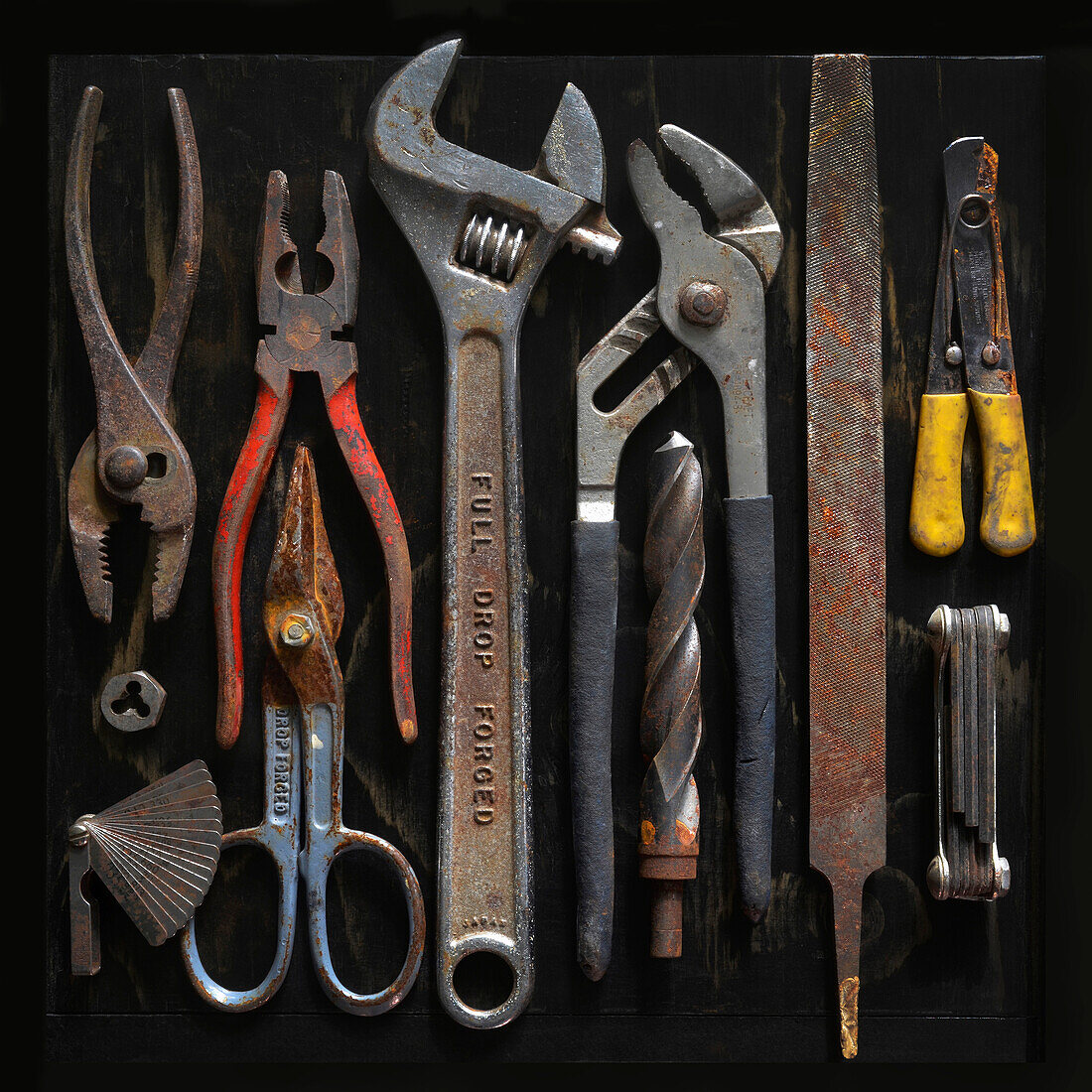 Overhead View of Assorted Old and Rusty Tools