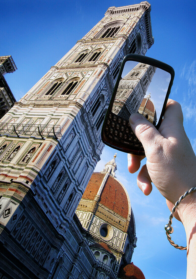 Woman's Hand Taking Photo of Basilica di Santa Maria del Fiore, Florence, Italy