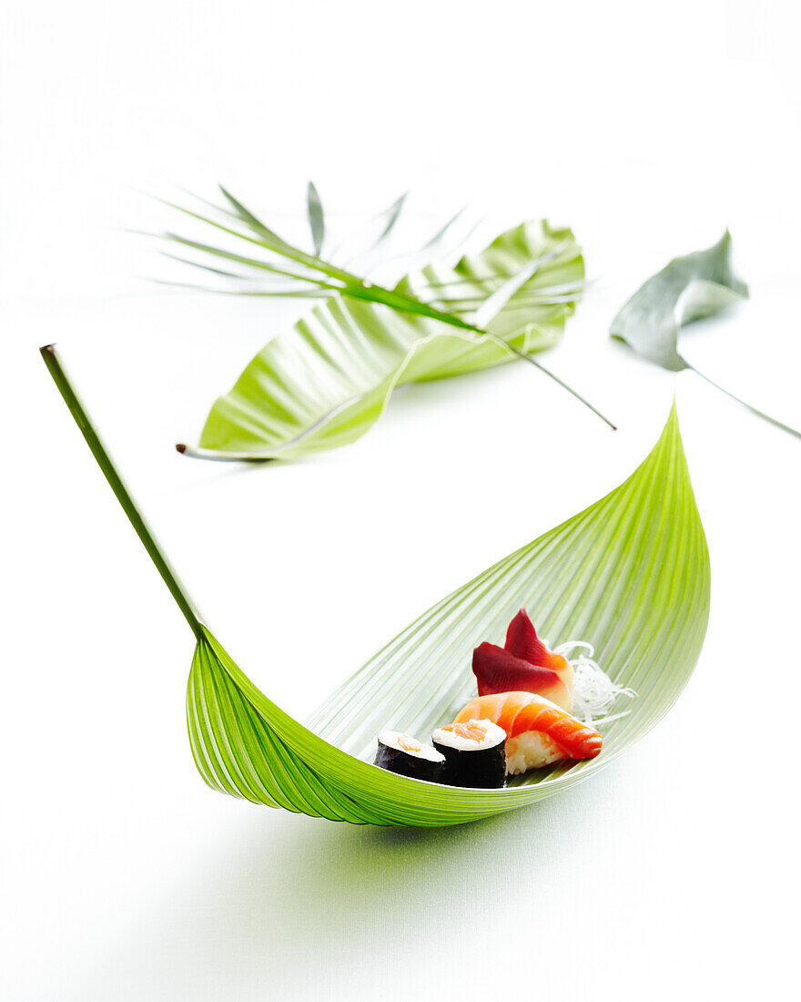 Sushi on bamboo leaf, studio shot