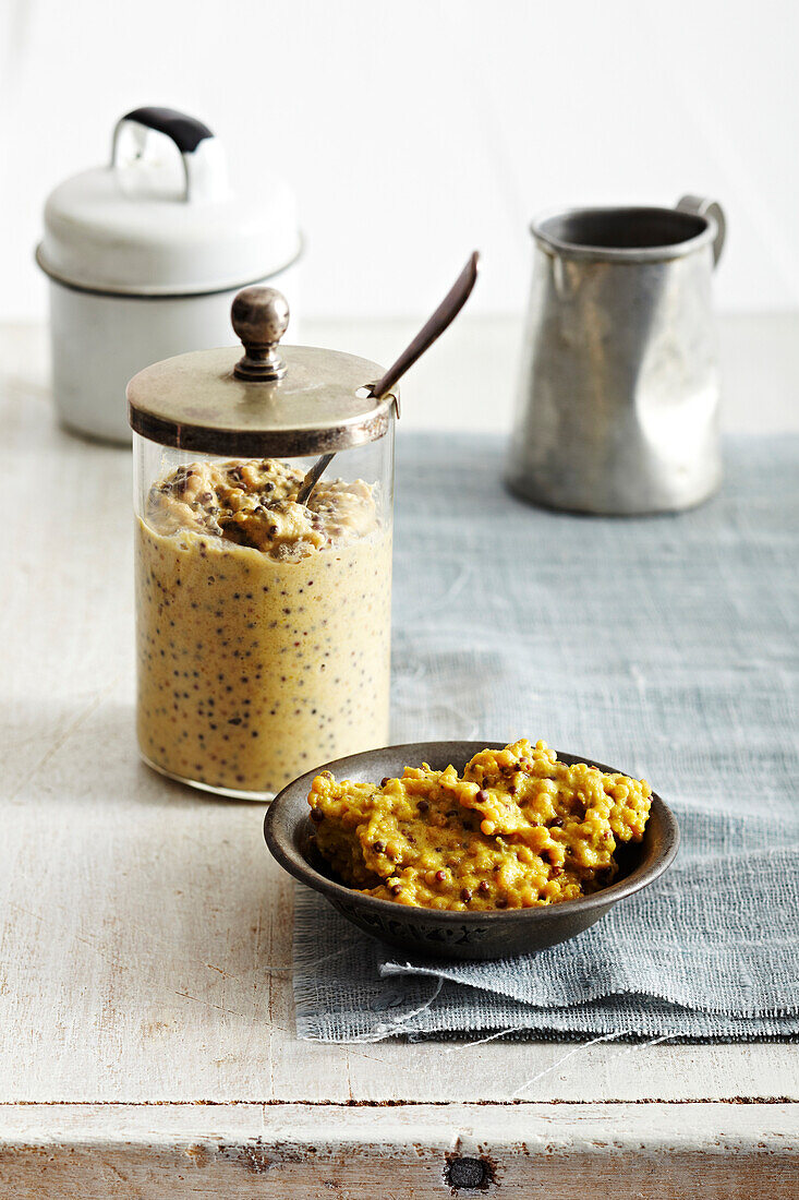 Homemade Mustard in jar and in bowl, studio shot