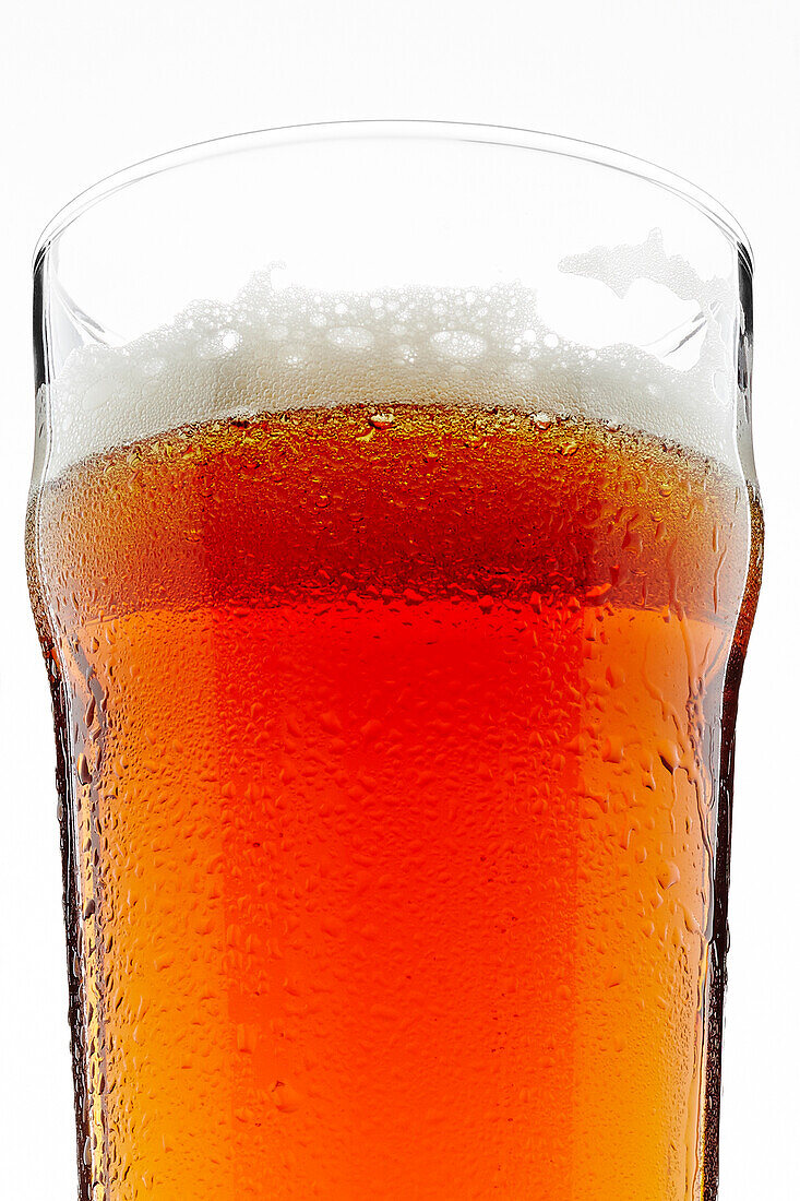 Close-up of Glass of Beer on White Background