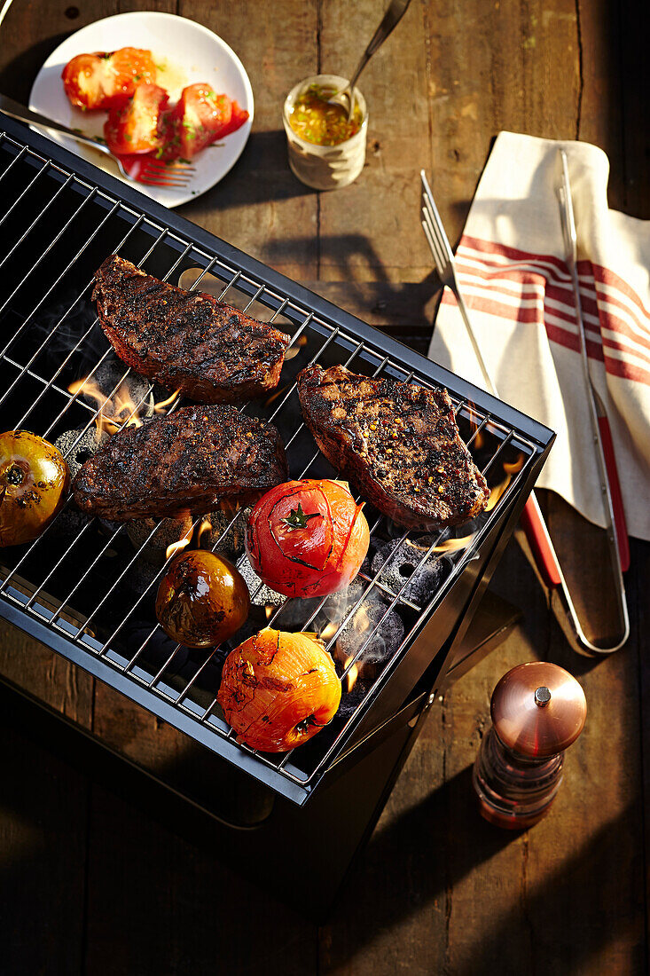 Steaks and Tomatoes on Barbeque