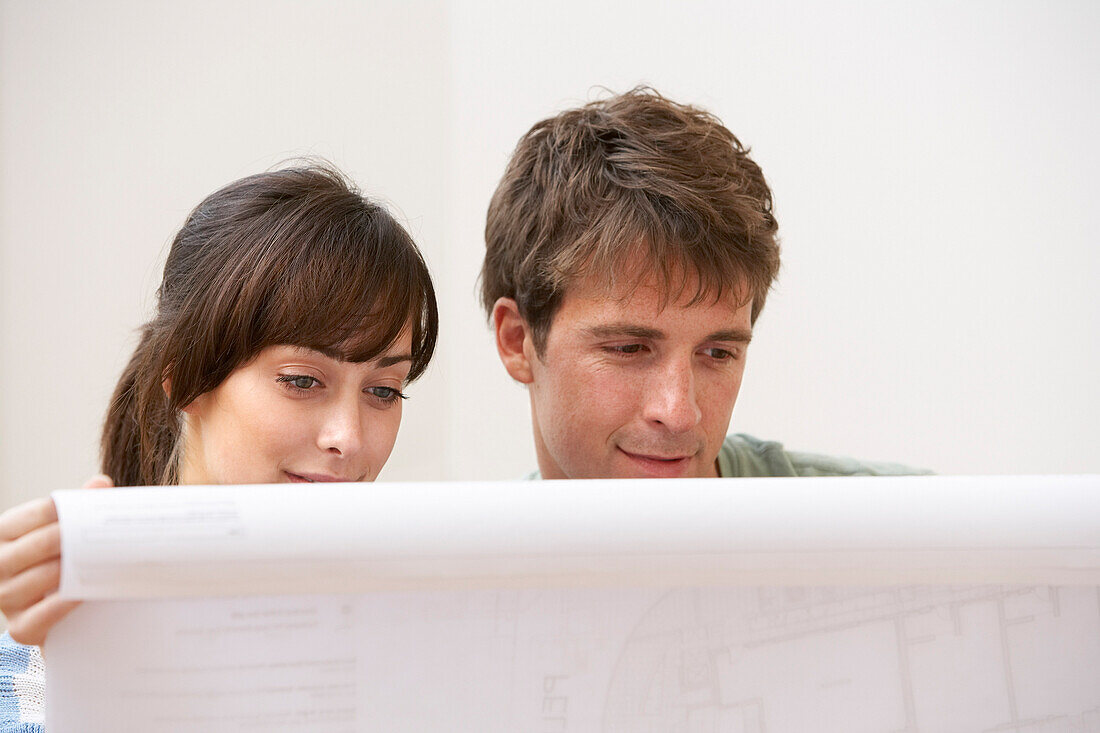 Couple Looking at Building Plans