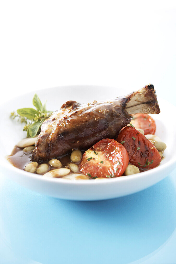 Lamb Shank Dish With White Beans, Tomatoes and Basil