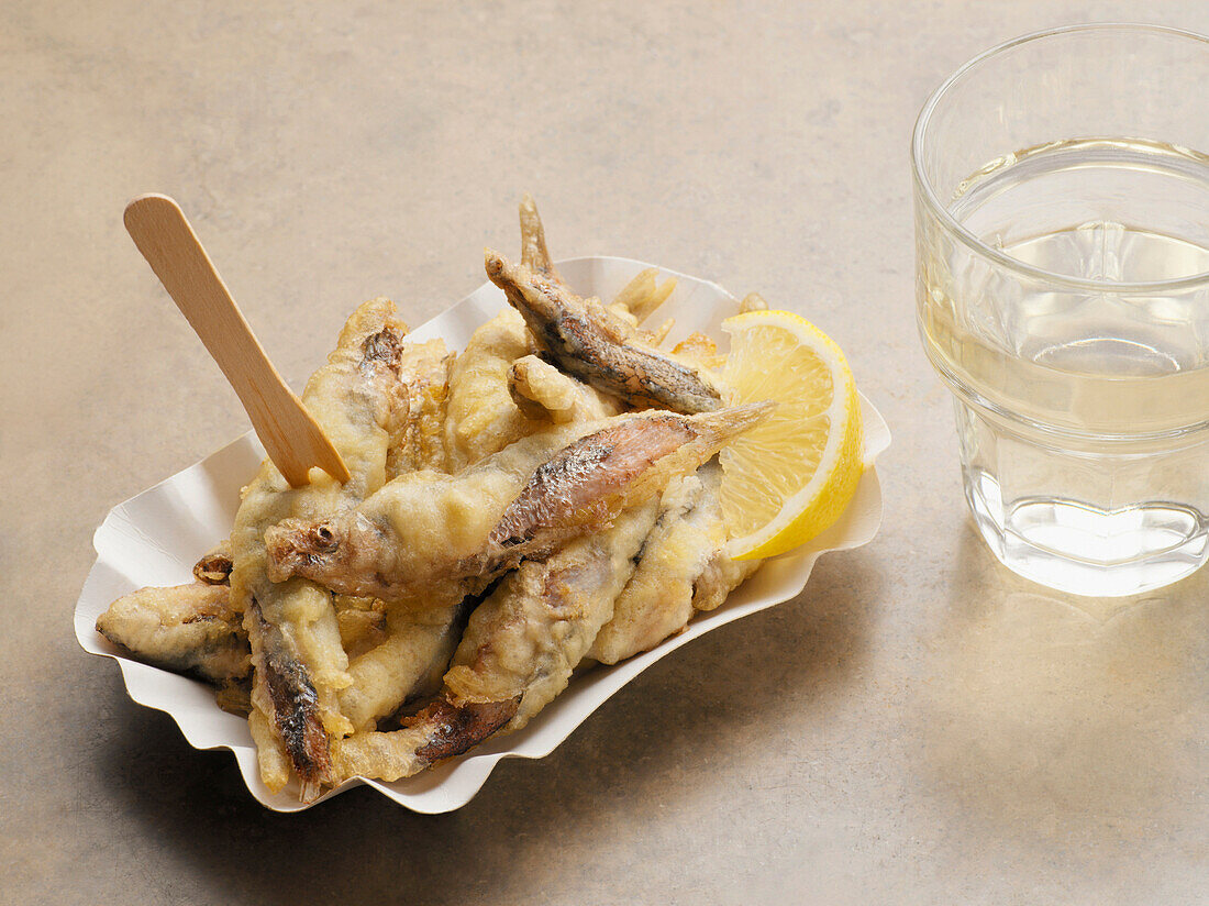 Fried Sardines with Glass of Water, Studio Shot