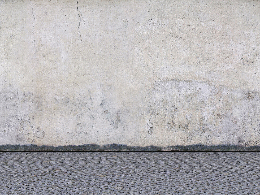 Digitale Illustration einer verwitterten Betonmauer und eines Kopfsteinpflasters