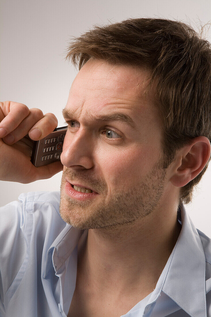 Angry Man Talking on Cell Phone