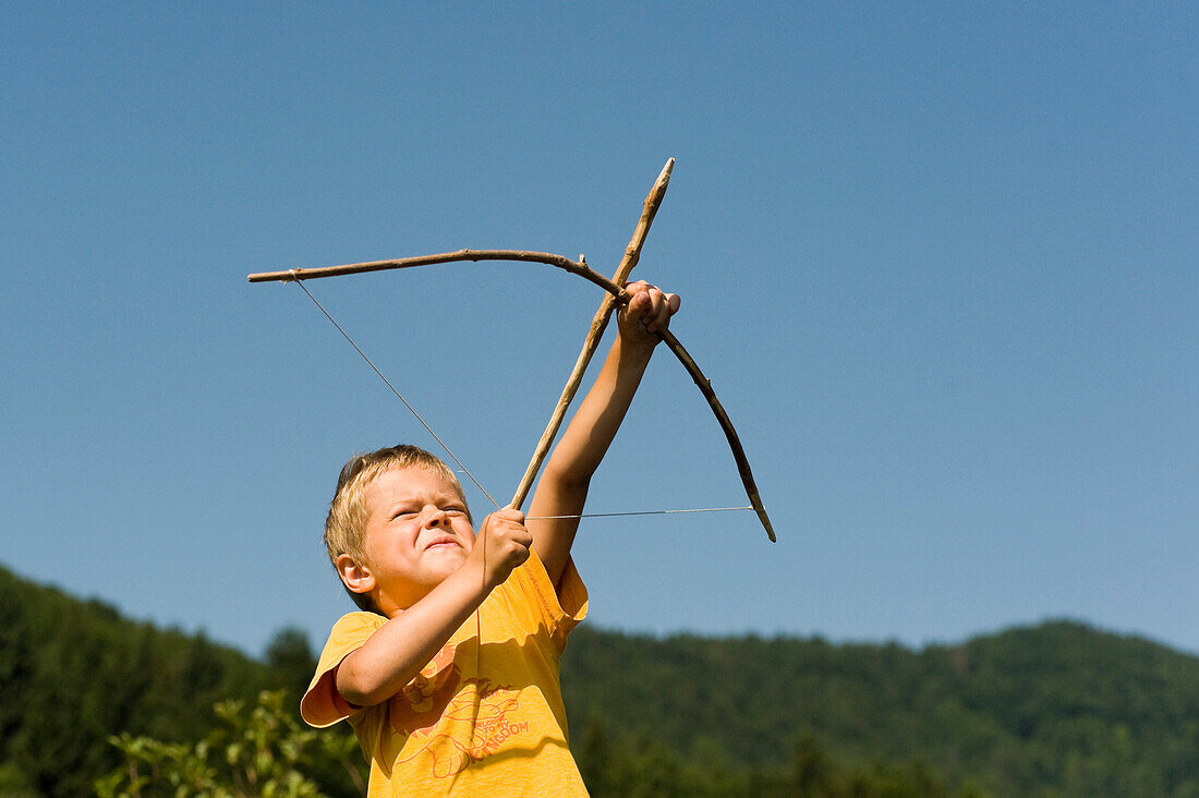 Boy Shooting Arrow, Salzburg, Salzburger Land, Austria