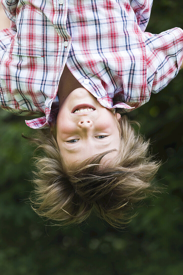 Boy Hanging Upside Down, Salzburger Land, Austria