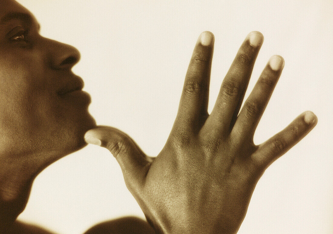 Hand and Profile of Face
