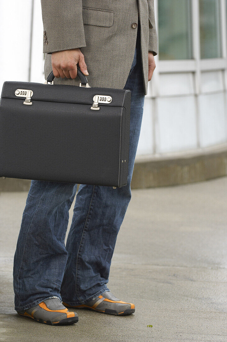 Man Holding Briefcase