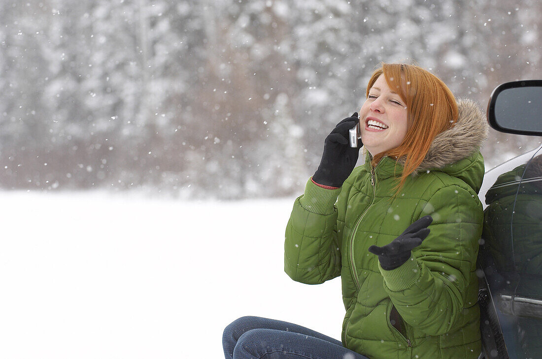 Woman Using Cellular Telephone Outdoors