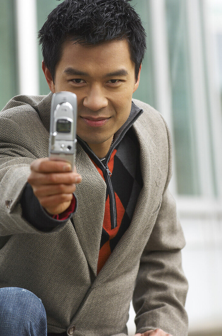 Man Taking Photo with Camera Phone