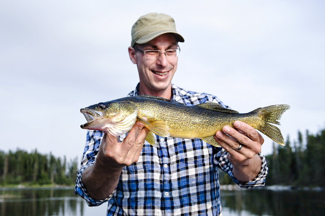 Man Fishing, Otter Lake, Missinipe, Saskatchewan, Canada