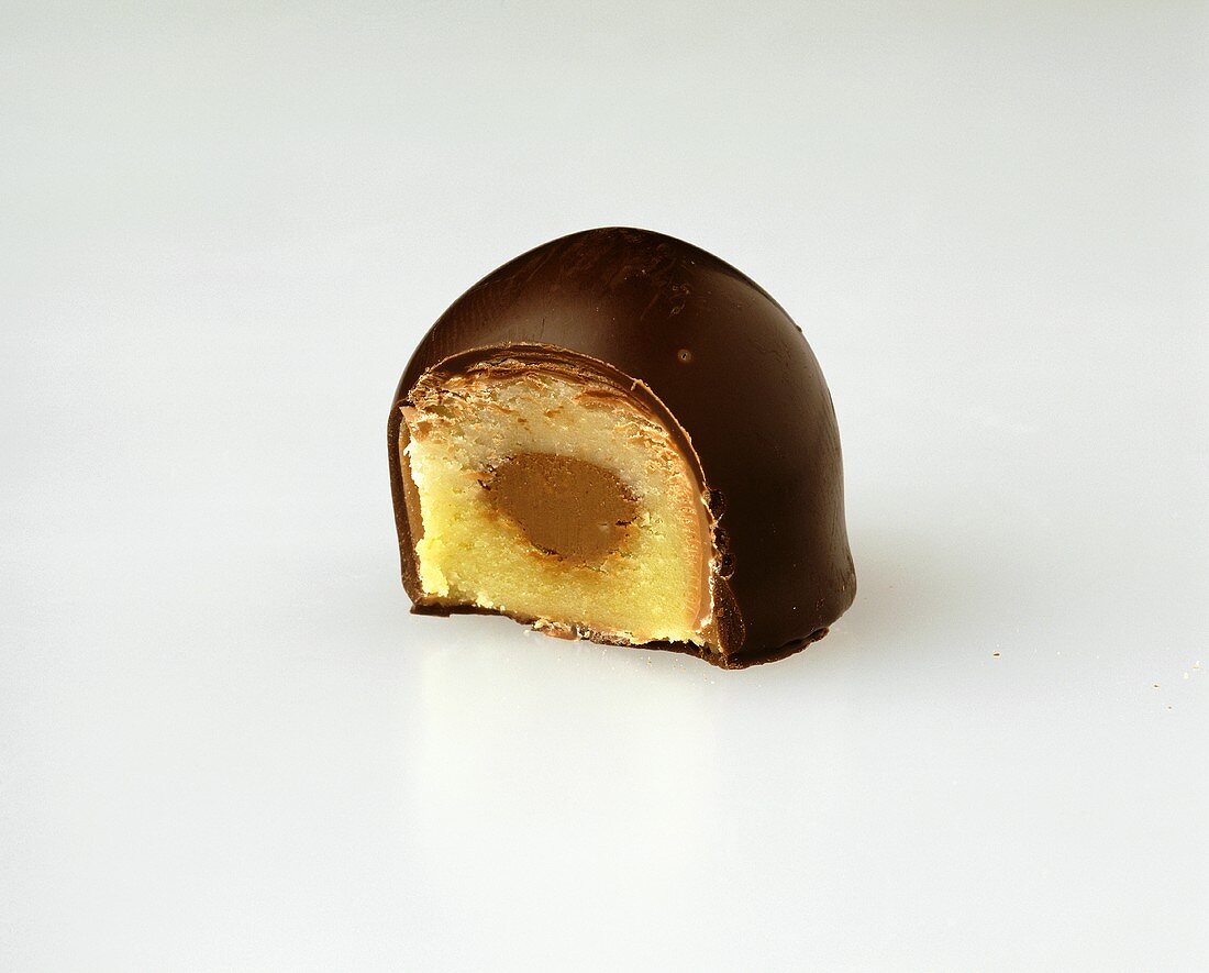 A Chocolate Bonbon with a Bite Taken Out