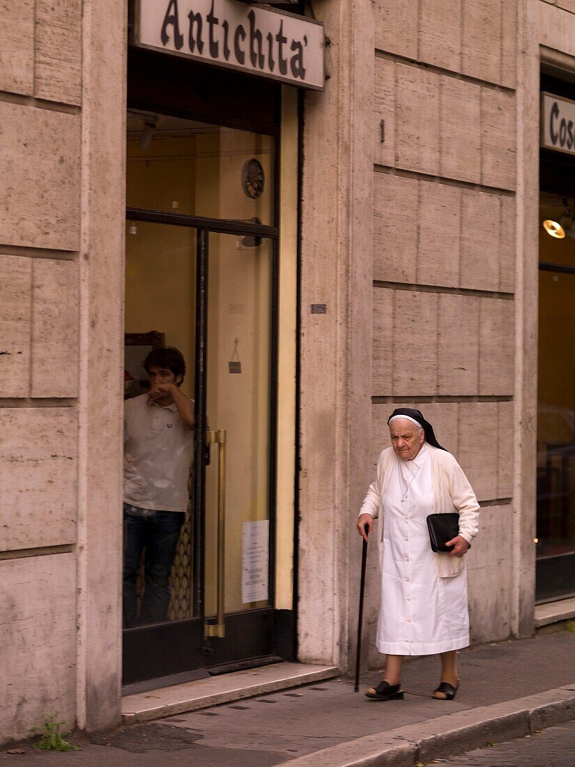 Nun Walking Down The Street; Rome, Italy