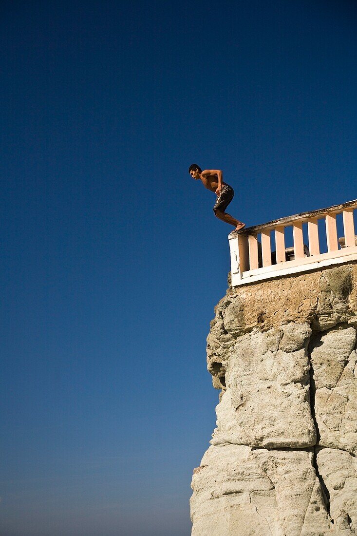 Cliff Diver Jumping From Sanchez Tadoada Promenade; Mazatlan, Sinaloa, Mexico