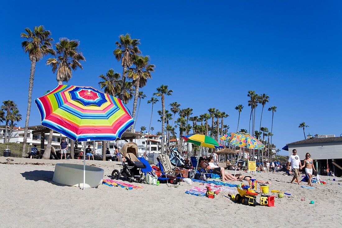 People Sunbathing On San Clemente Beach; San Clemente, Orange County, California, Usa