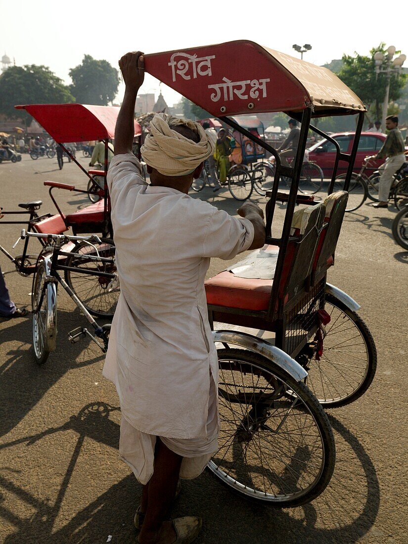 Man Preparing Rickshaw; Jaipur, India