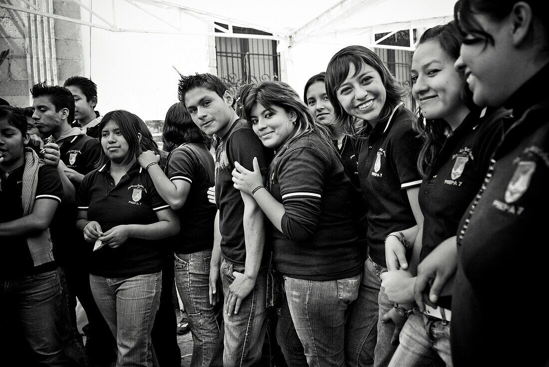 Teenage Girls And Boys In School Uniforms Standing Side By Side; Mexico