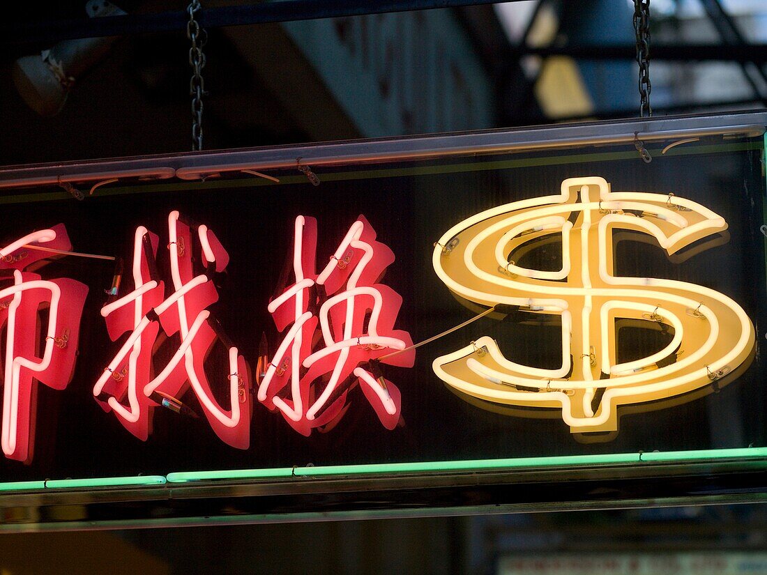 Neon Currency Sign On Street; Hong Kong, China