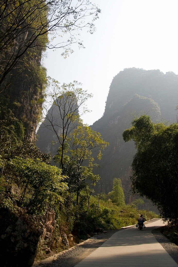 Yangshuo, China; Person Walking Down Country Road