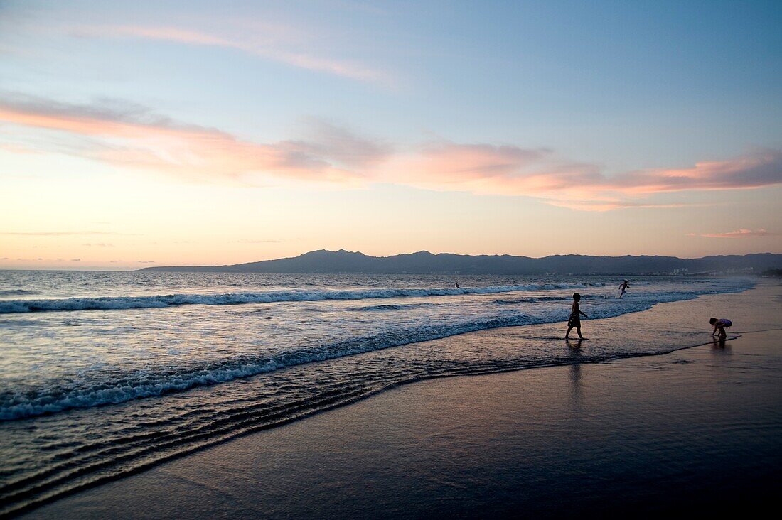 Puerto Vallarta, Mexico; People Walking Along Seashore