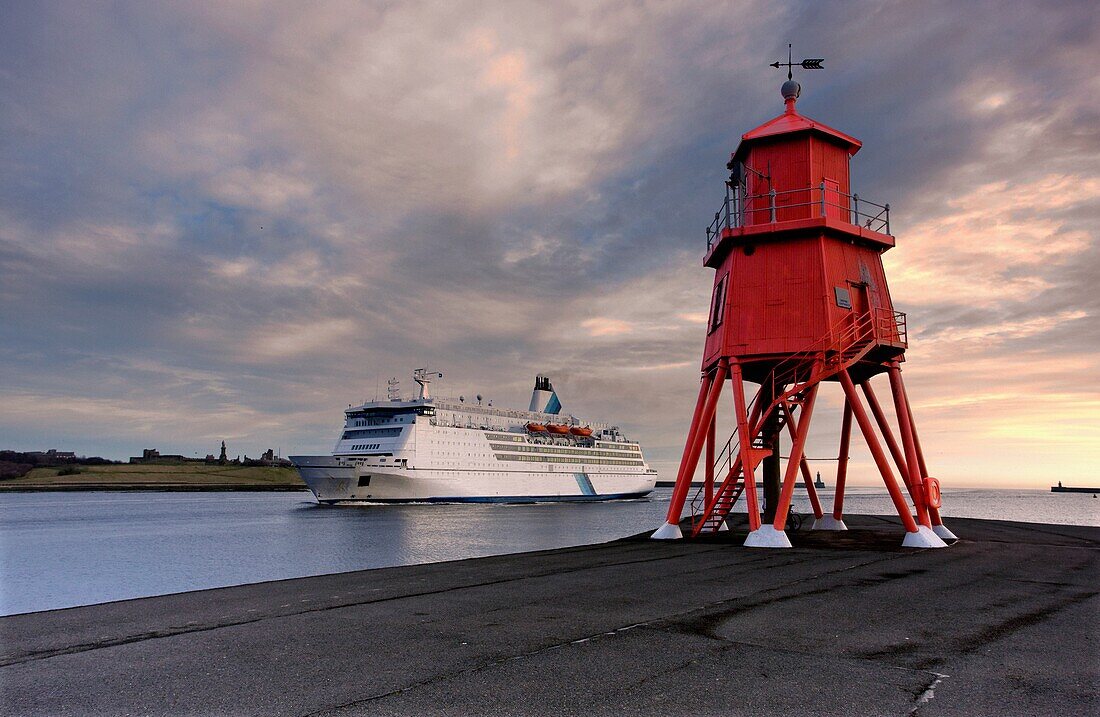 Groyne Lighthouse With Large Boat Going By In Background